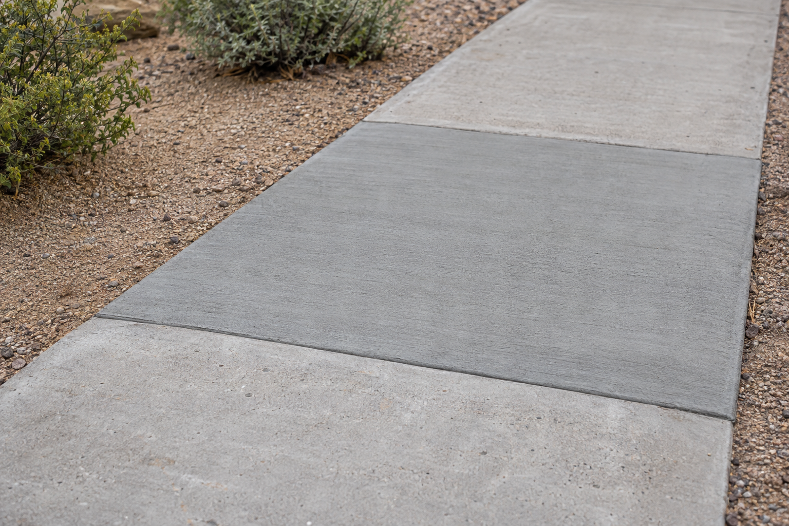 new concrete sidewalk section with control joints